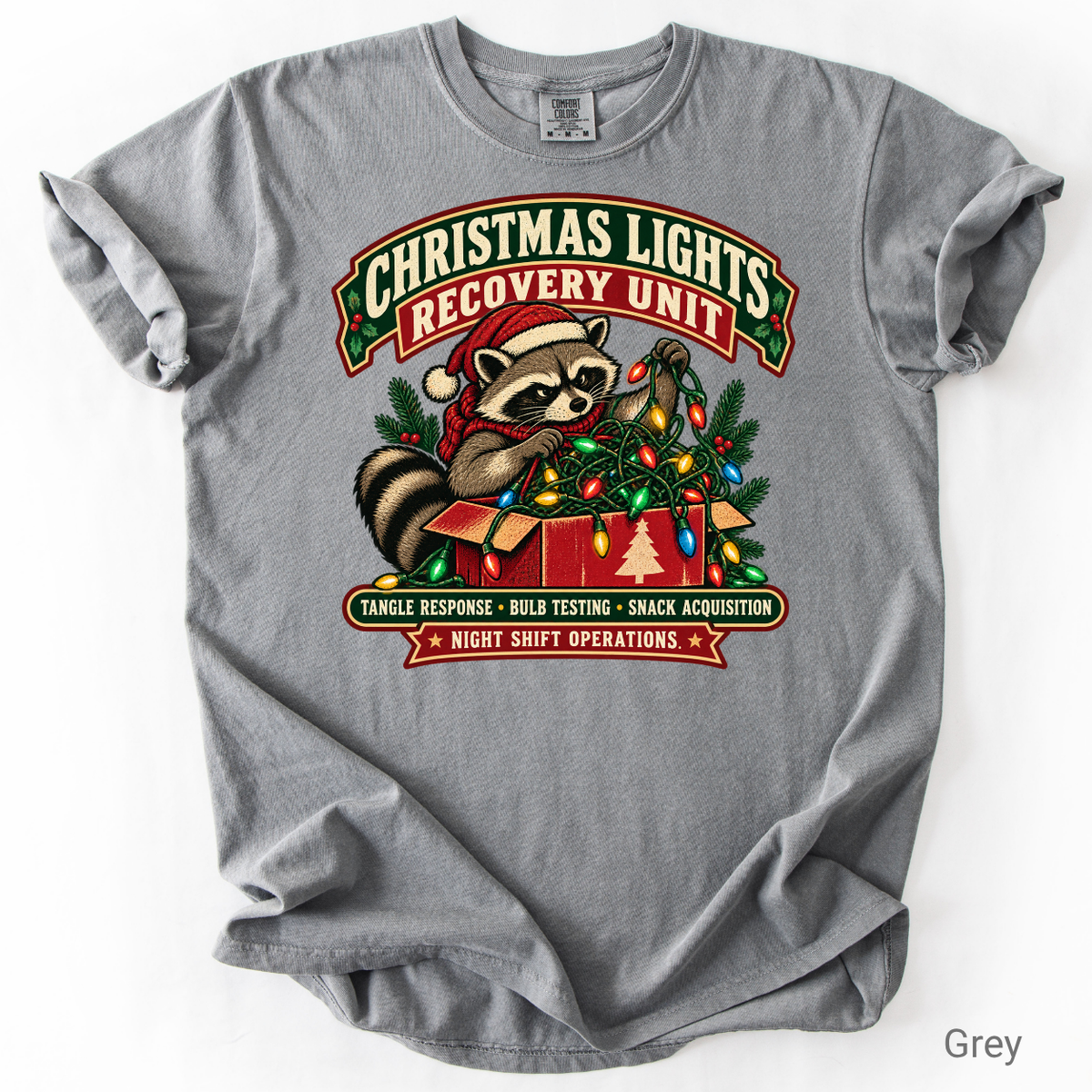 Vintage-style Christmas Lights Recovery Unit design featuring a raccoon in a Santa hat tangled in colorful Christmas lights beside a gift box.
